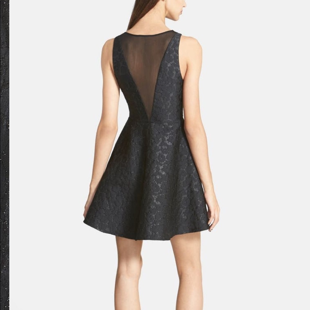Black Dress with Sheer Panels and Subtle Sparkle